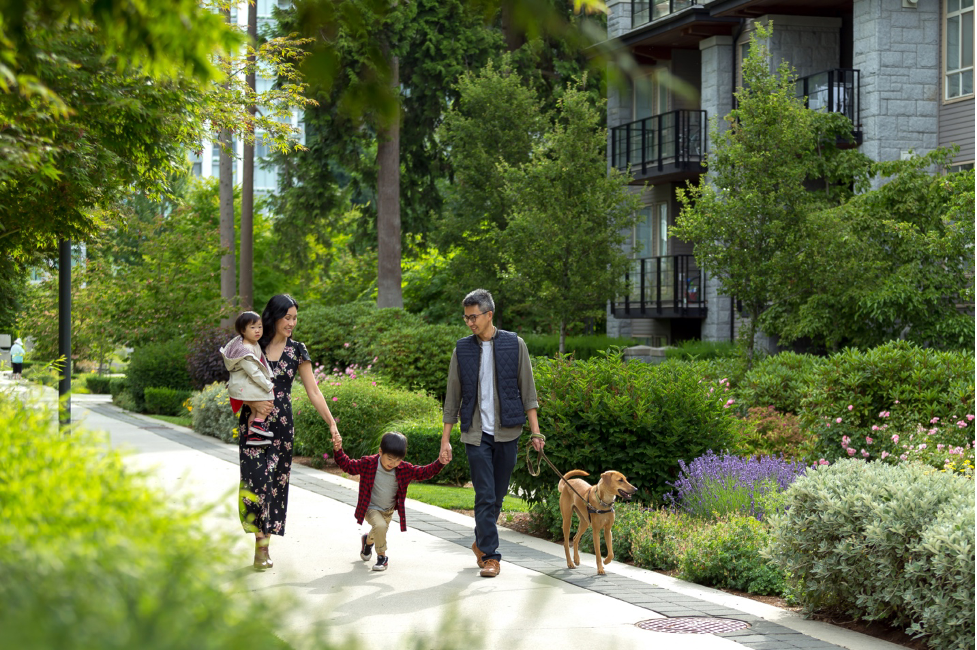 Family walking through Wesbrook Village