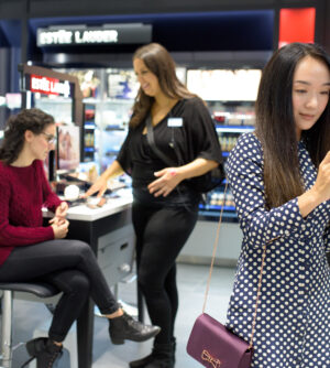 Woman shopping for makeup at Shoppers Drug Mart