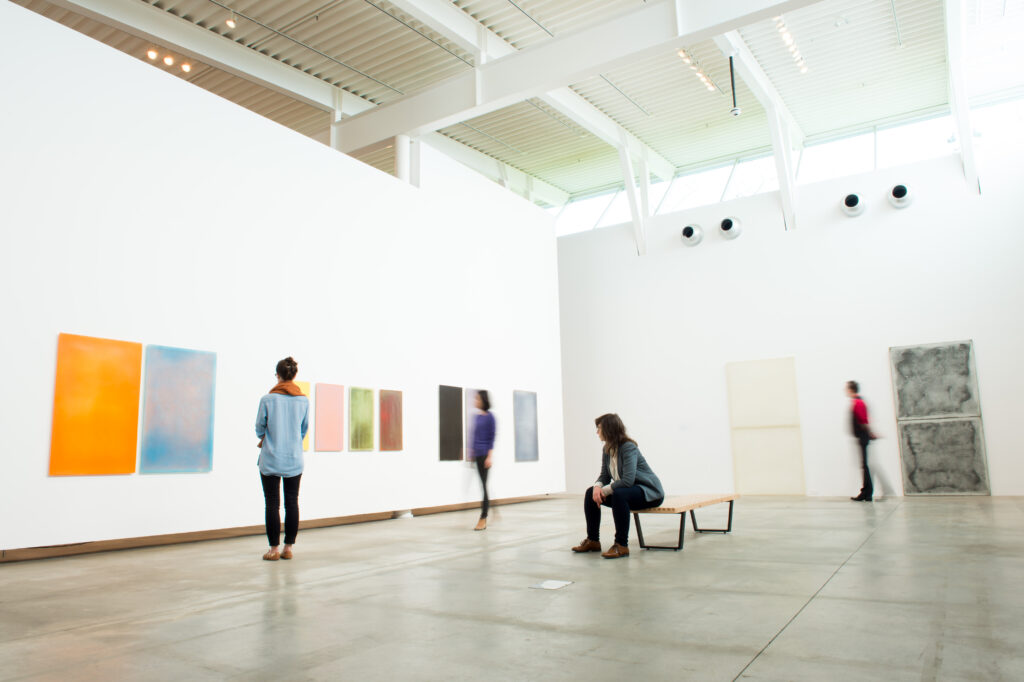 People looking at art in the Belkin Art Gallery.