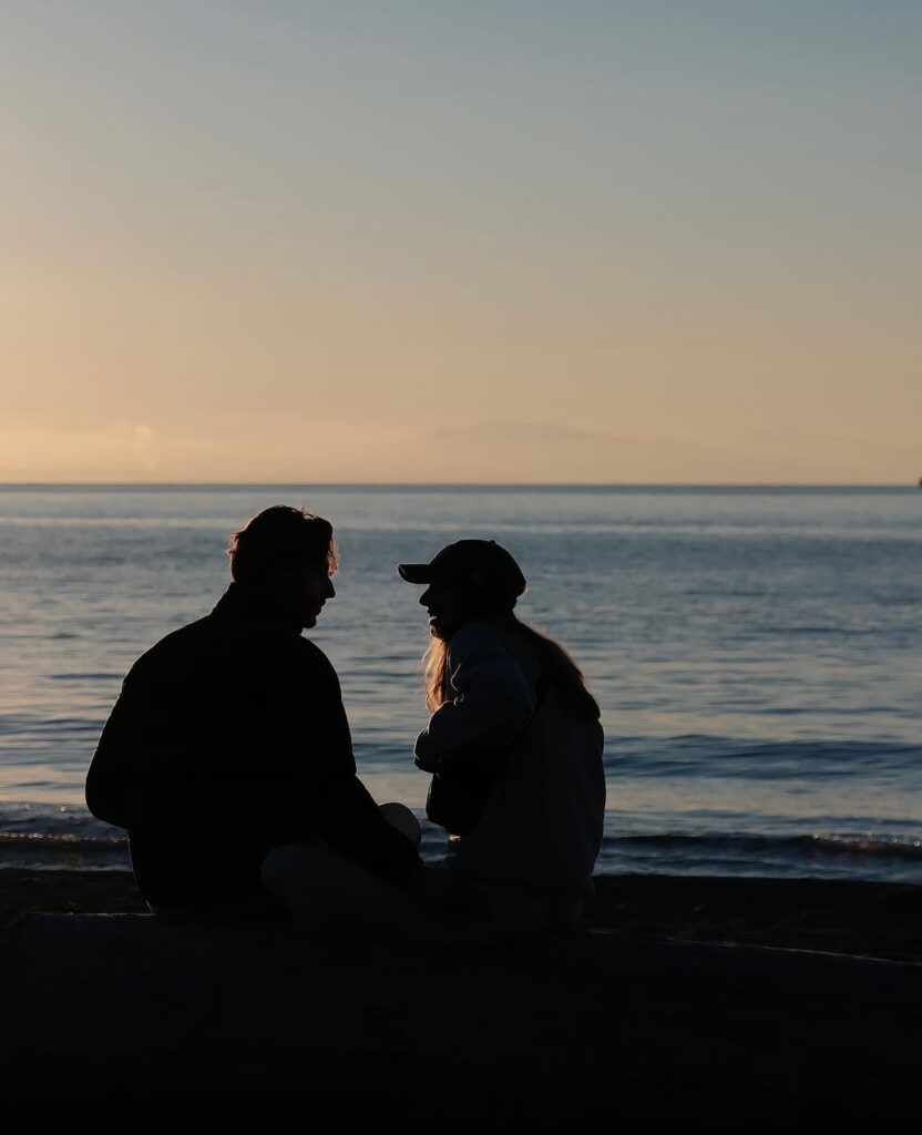 Two people at Wreck Beach at UBC